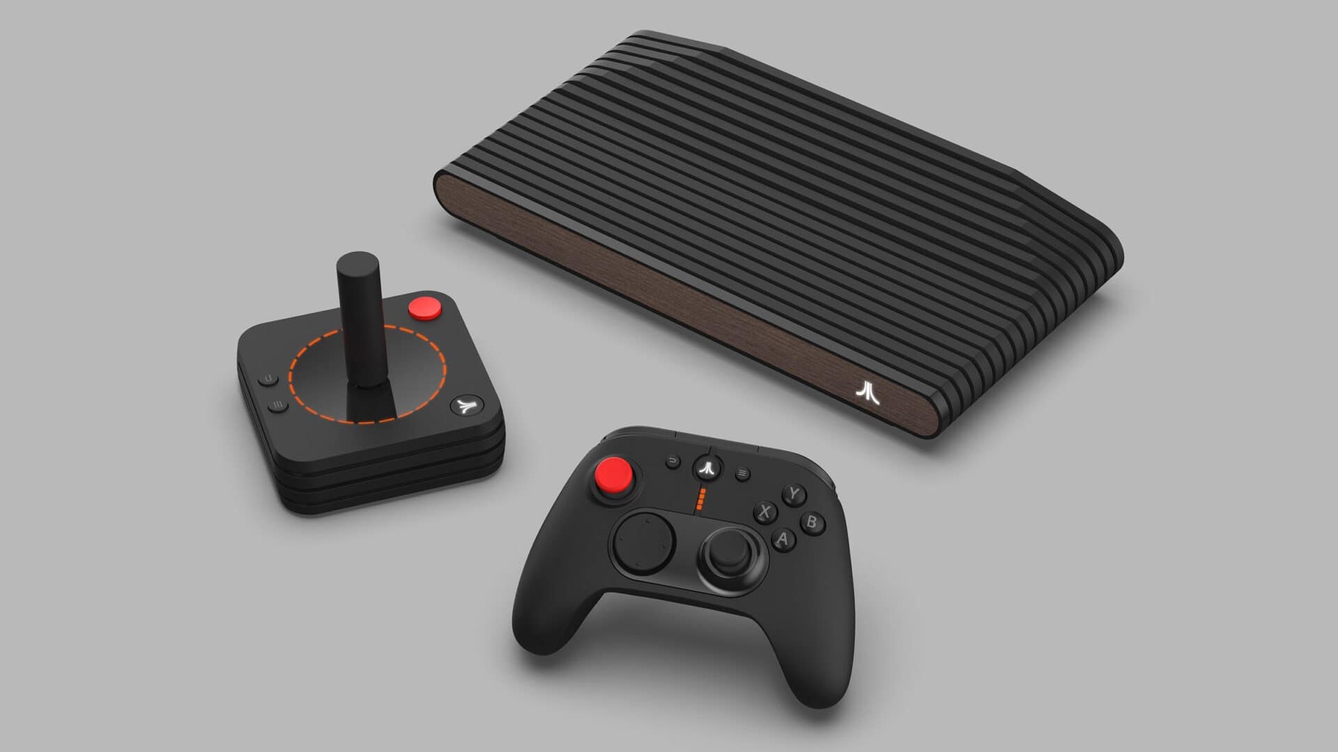 Console Atari VCS ao lado de seu joystick retrô e do controle moderno