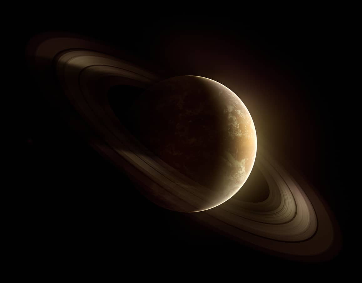 Ilustração representa o planeta Saturno, no fundo escuro do universo com seus anéis em destaque