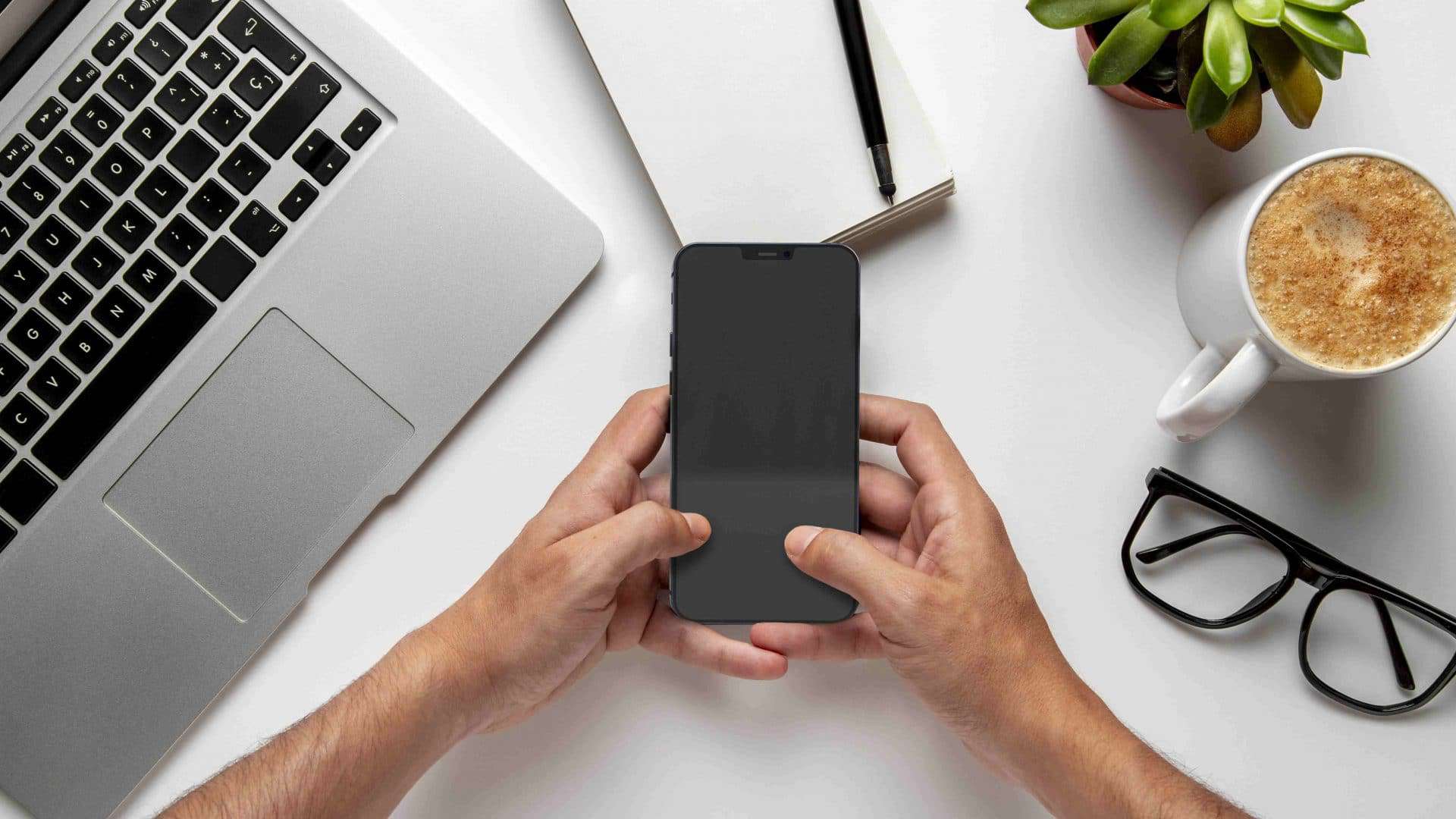 top-view-man-checking-his-smartphone