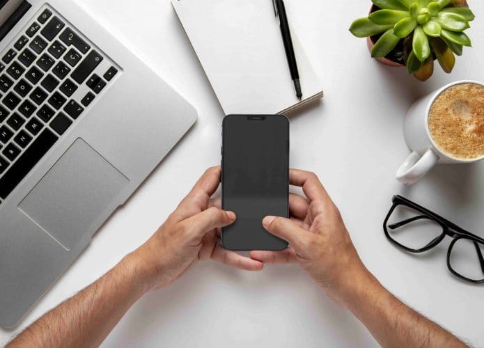 top-view-man-checking-his-smartphone
