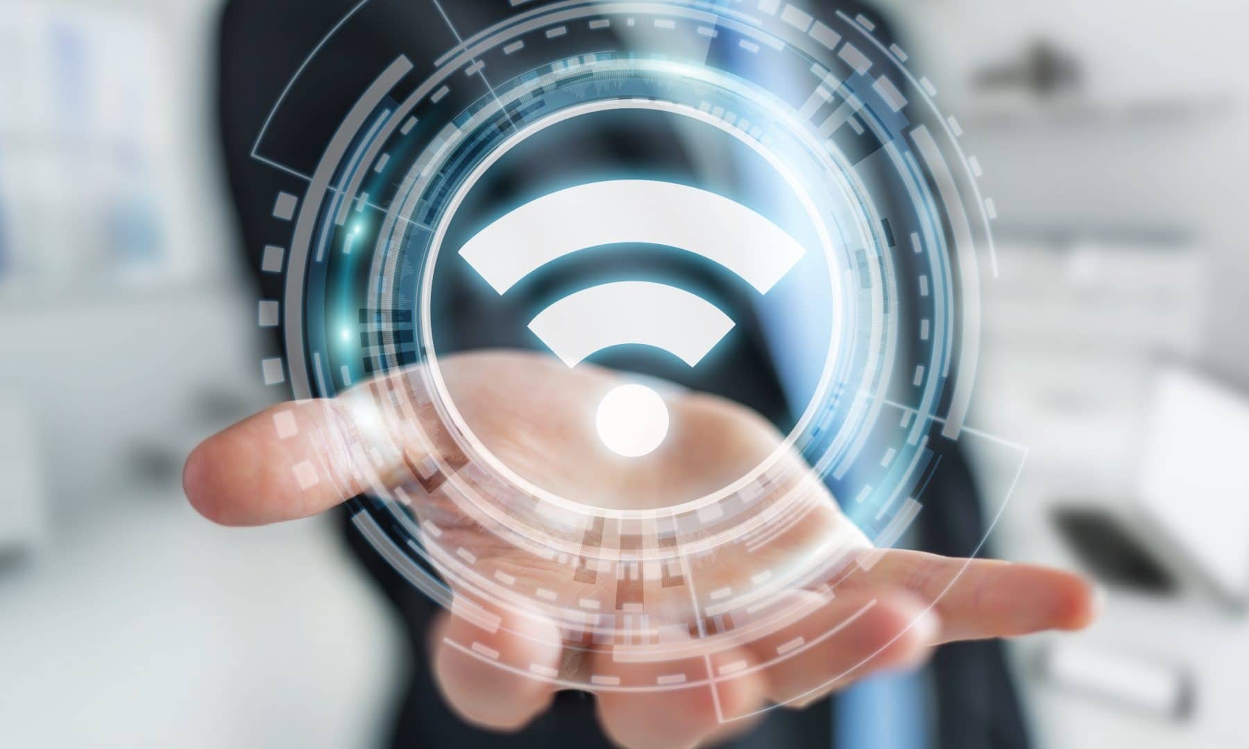 Empresário em fundo desfocado usando Wi-Fi gratuito interface hotspot 3D renderização