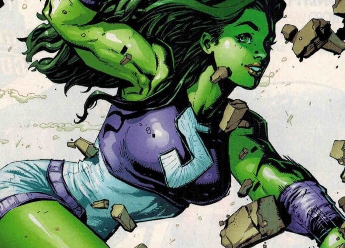 Imagem da capa de um dos gibis da Mulher-Hulk, com a heroína da Marvel atravessando uma parece de concreto