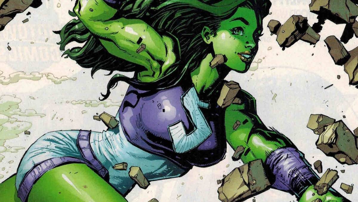 Imagem da capa de um dos gibis da Mulher-Hulk, com a heroína da Marvel atravessando uma parece de concreto