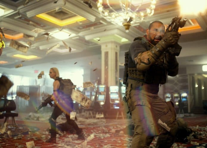 ARMY OF THE DEAD - (L-R) NORA ARNEZEDER as LILLY and DAVE BAUTISTA as SCOTT WARD. Cr: NETFLIX © 2021