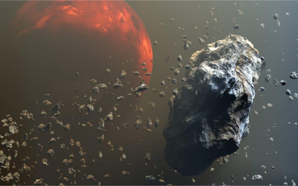 Ilustração em 3D mostra o cinturão de asteroides, com Marte ao fundo