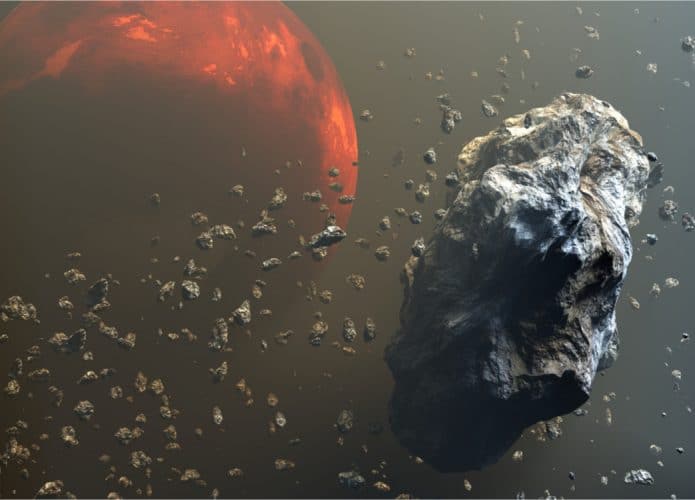 Ilustração em 3D mostra o cinturão de asteroides, com Marte ao fundo