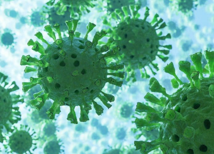 Imagem possui a ilustração de diversos coronavirus