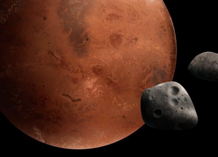 Ilustração em 3D mostra Marte, com as luas Fobos e Deimos em evidência