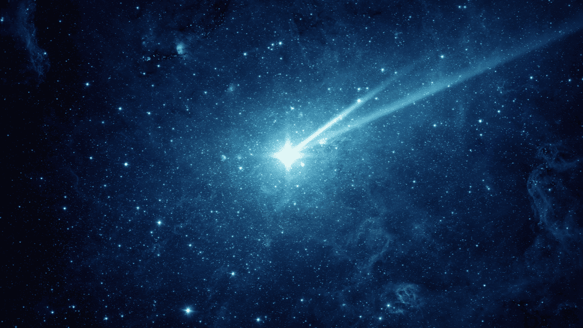 Imagem de um cometa atravessando um céu estrelado