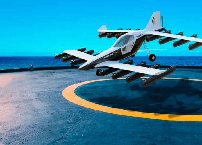 evtol de duas asas levantando voo em hangar no meio do mar