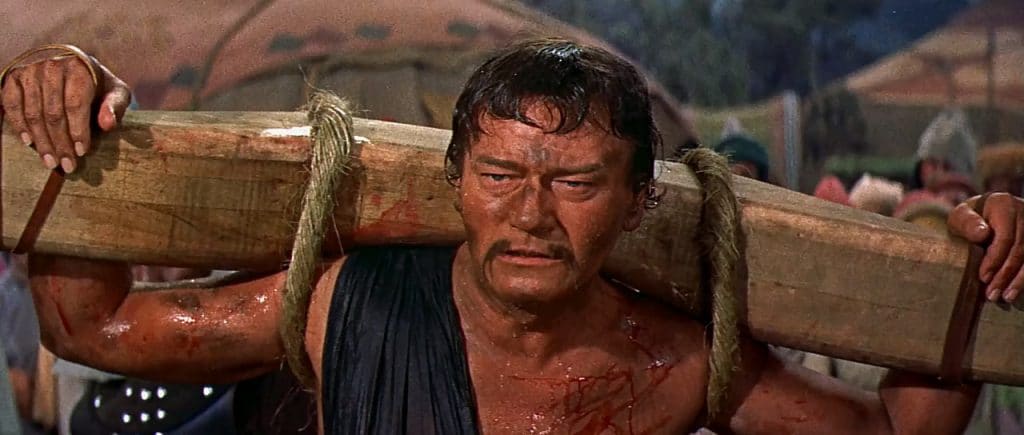 'Sangue de Bárbaros' (1956) não foi, definitivamente, um dos pontos altos da carreira de John Wayne. Imagem: RKO Pictures/Reprodução