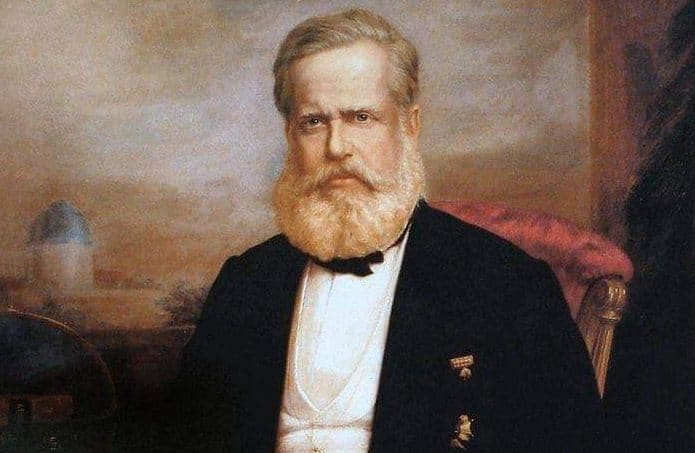 D. Pedro II retratado em 1875 por Delfim Câmara. Ao Fundo, é possível ver a cúpula do antigo Imperial Observatório, que ficava no extinto Morro do Castelo, no centro do Rio de Janeiro