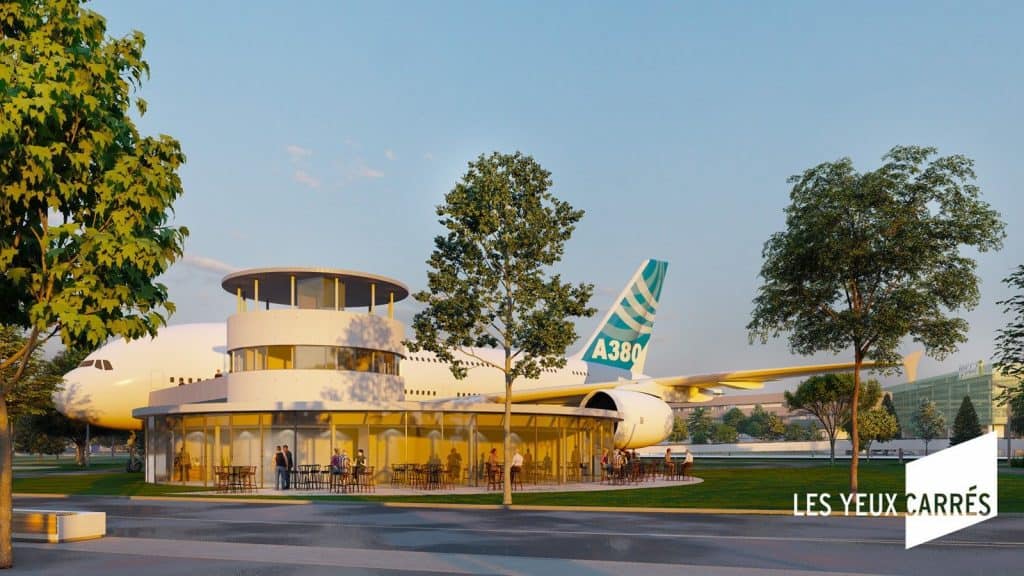 Um restaurante em forma de torre de comando ao lado do avião transformado em hotel