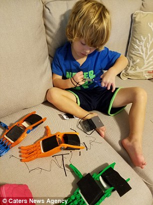 He is pictured putting a hand together