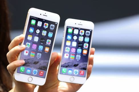 The iPhone 6 Plus, left, and iPhone 6.