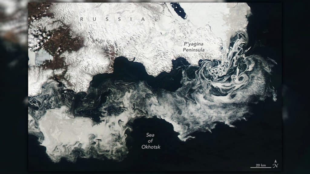 Imagem capturada por satélite de dança de redemoinhos de gelo no Ártico
