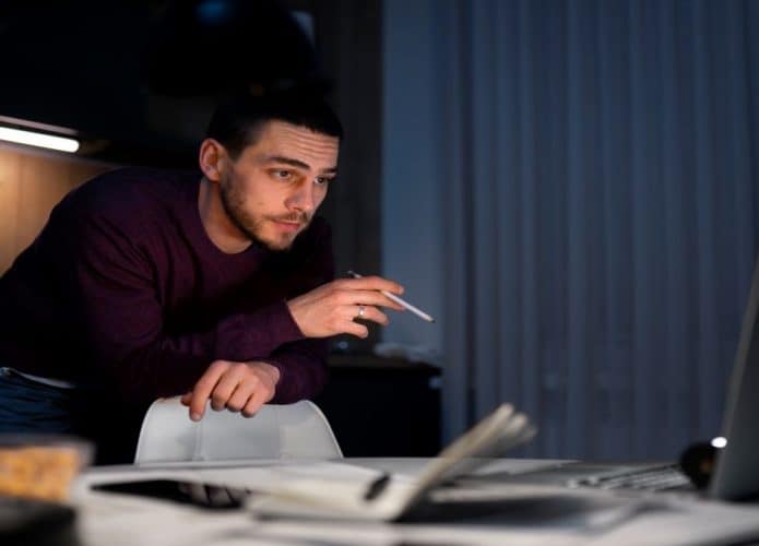 side-view-man-working-late-night-695x500