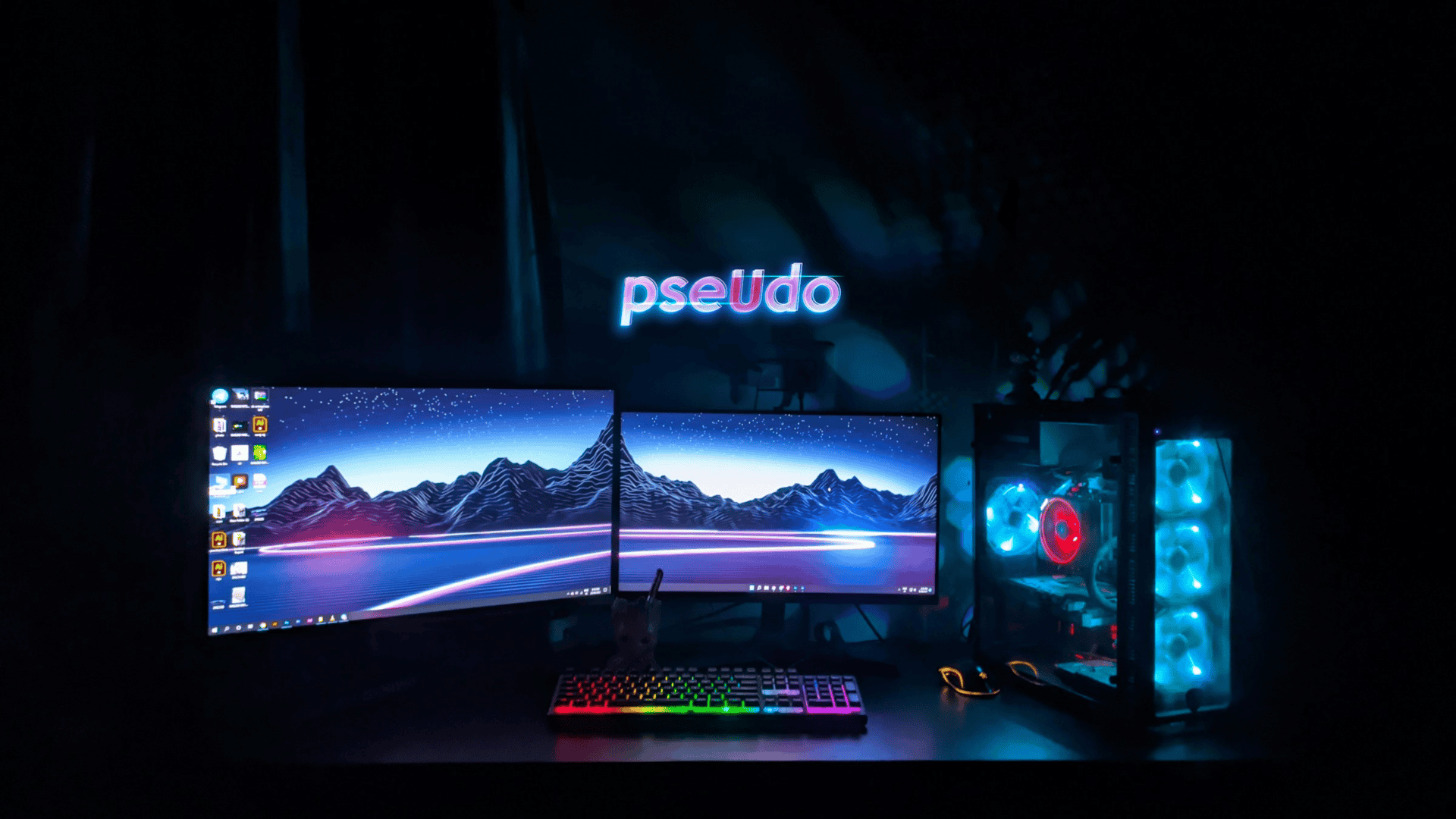 imagem mostra computador gamer com duas telas e sistema de hardware iluminado com LED RGB