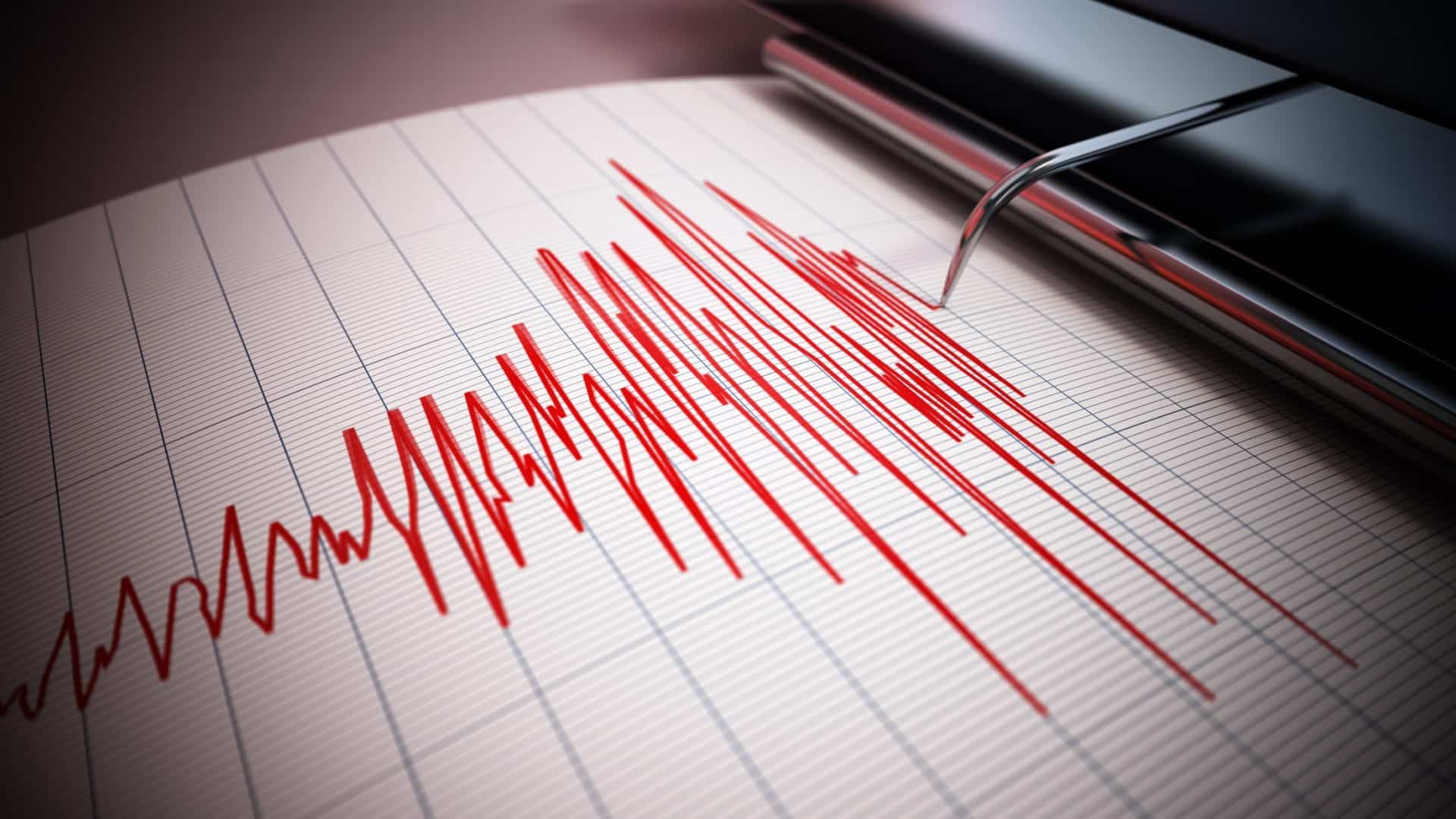 Agulha de sismógrafo desenhando linhas de terremoto forte