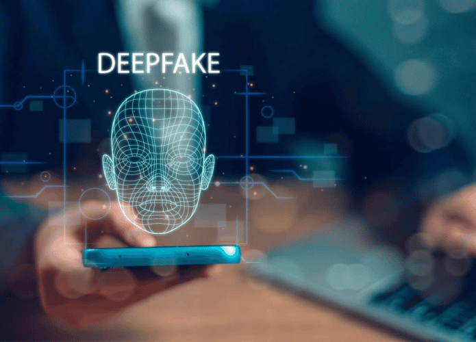 Imagem de um rosto escrito deepfake em cima e saindo de um smartphone