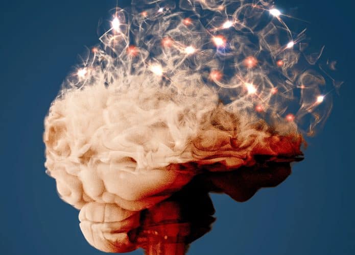 Ilustração de cérebro se desfazendo igual nuvem para representar neurodegeneração da Doença de Alzheimer