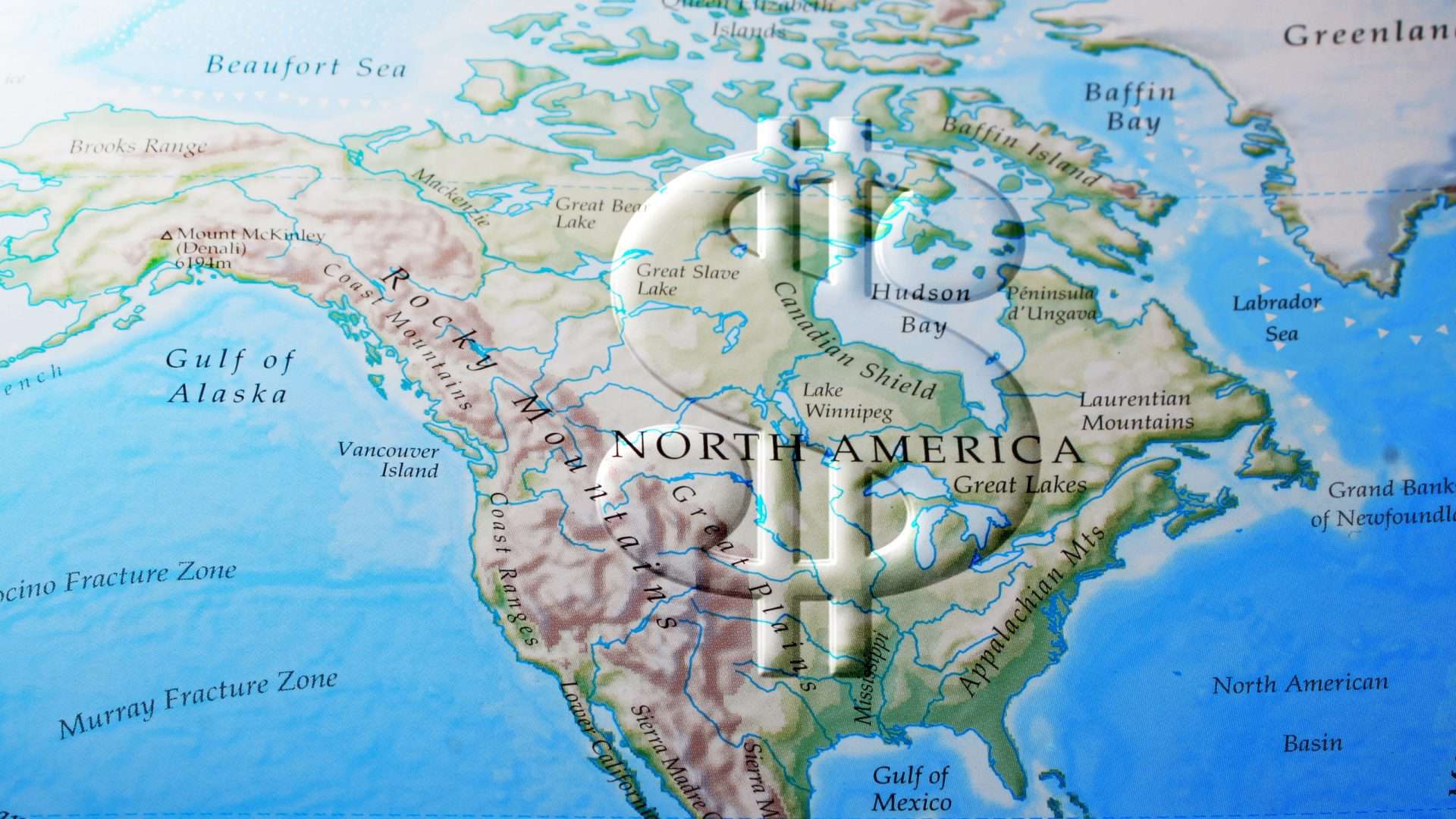 Mapa da América do Norte com um cifrão em cima