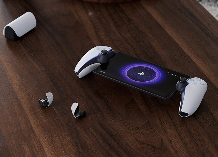 PlayStation Portal em cima de mesa com fones de ouvido sem fio da Sony ao lado