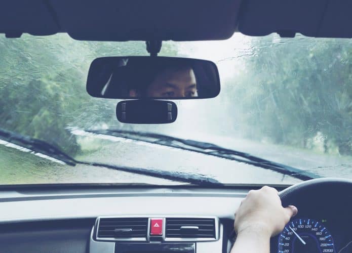 Man driving car in heavy rainfall