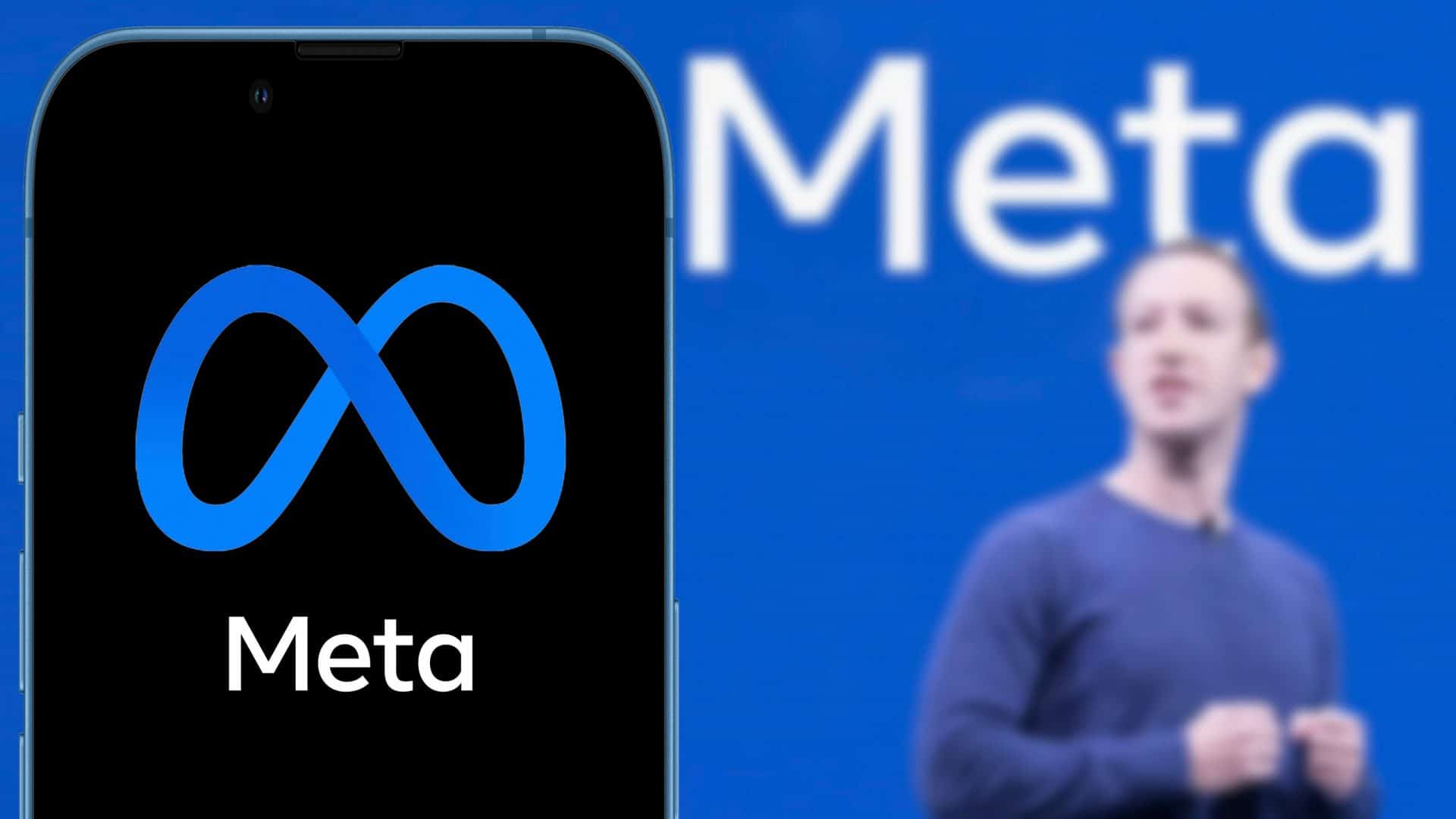 Smartphone com logo da Meta; ao fundo, desfocado, placa azul com o escrito 