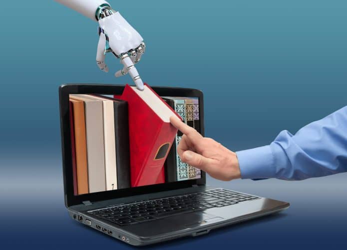 Um livro sendo projetado para fora de um notebook, com um robô tocando em uma ponta dele e uma pessoa tocando em outra
