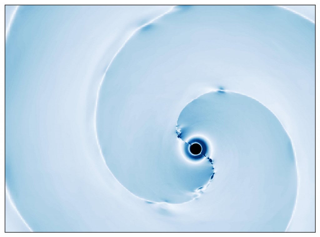 A imagem mostra um fluxo magnetizado de plasma lançado após a fusão de um buraco negro e uma estrela de nêutrons magnetizada. Os mapas em azul claro mostram a intensidade dos campos magnéticos nesse vento. O fluxo magnetizado é alimentado pela rotação do buraco negro remanescente, como um ventilador girando e empurrando o ar, de acordo com o informe da Caltech.