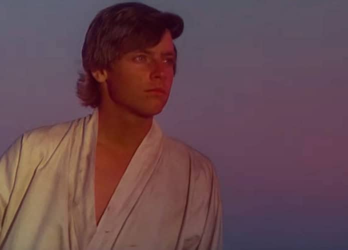 Cena de Luke Skywalker olhando para pôr do sol em Star Wars episódio 4, Uma Nova Esperança