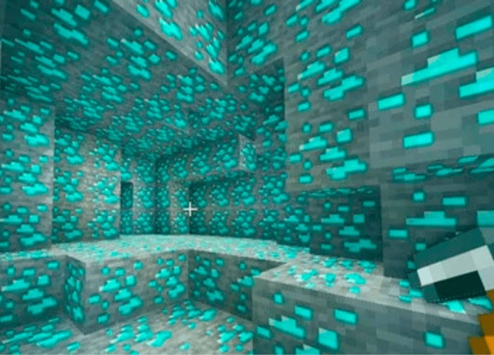 imagem do jogo minecraft com uma caverna repleta de diamantes