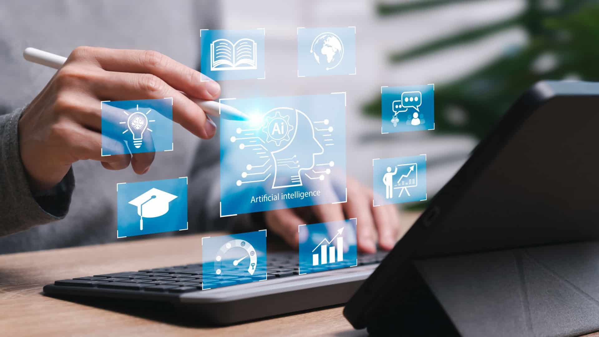 Pessoa com um teclado e tablet a frente, com icones digitais de leitura e aprendizado