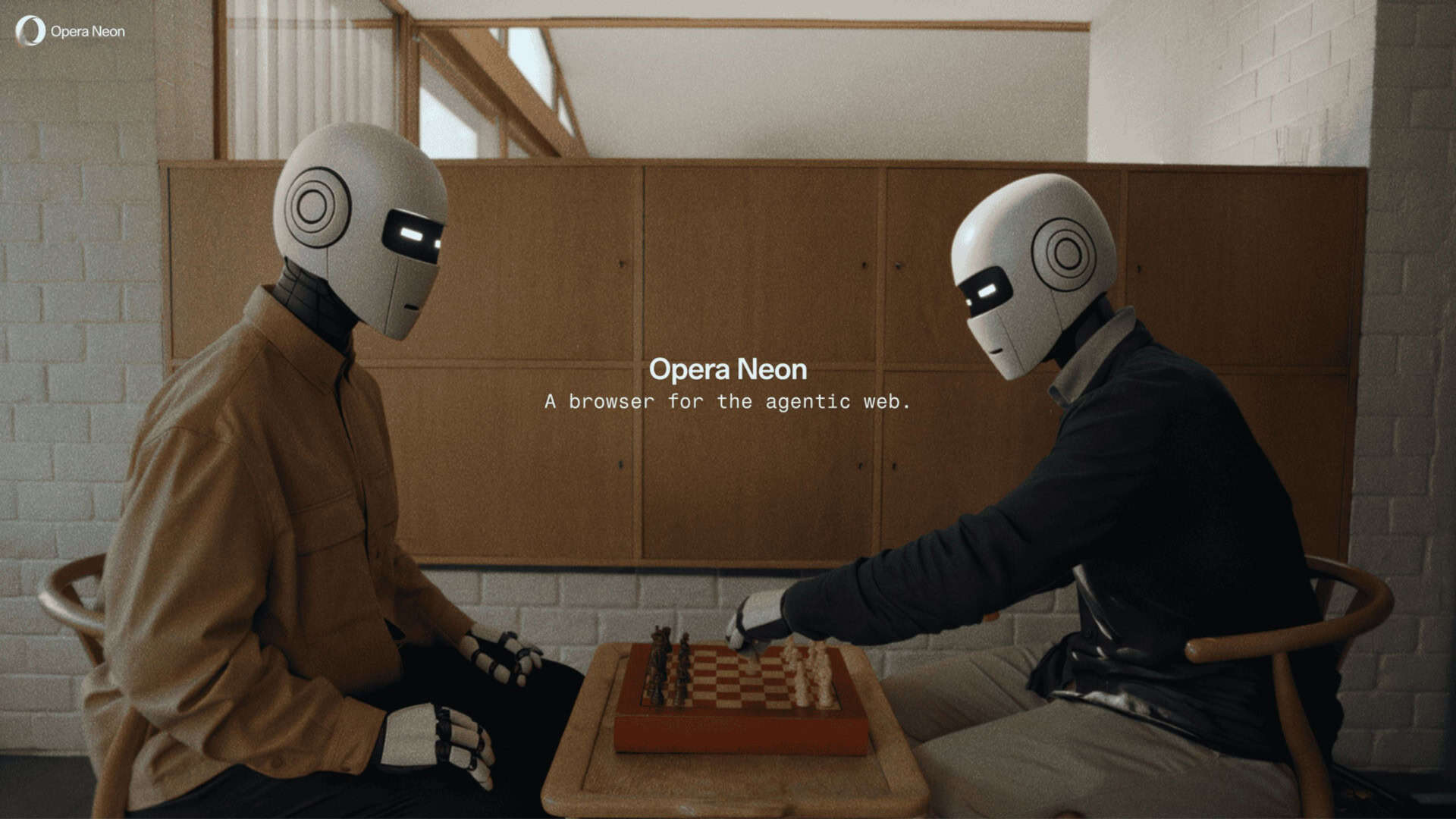 dois robôs sentados em uma mesa interagindo