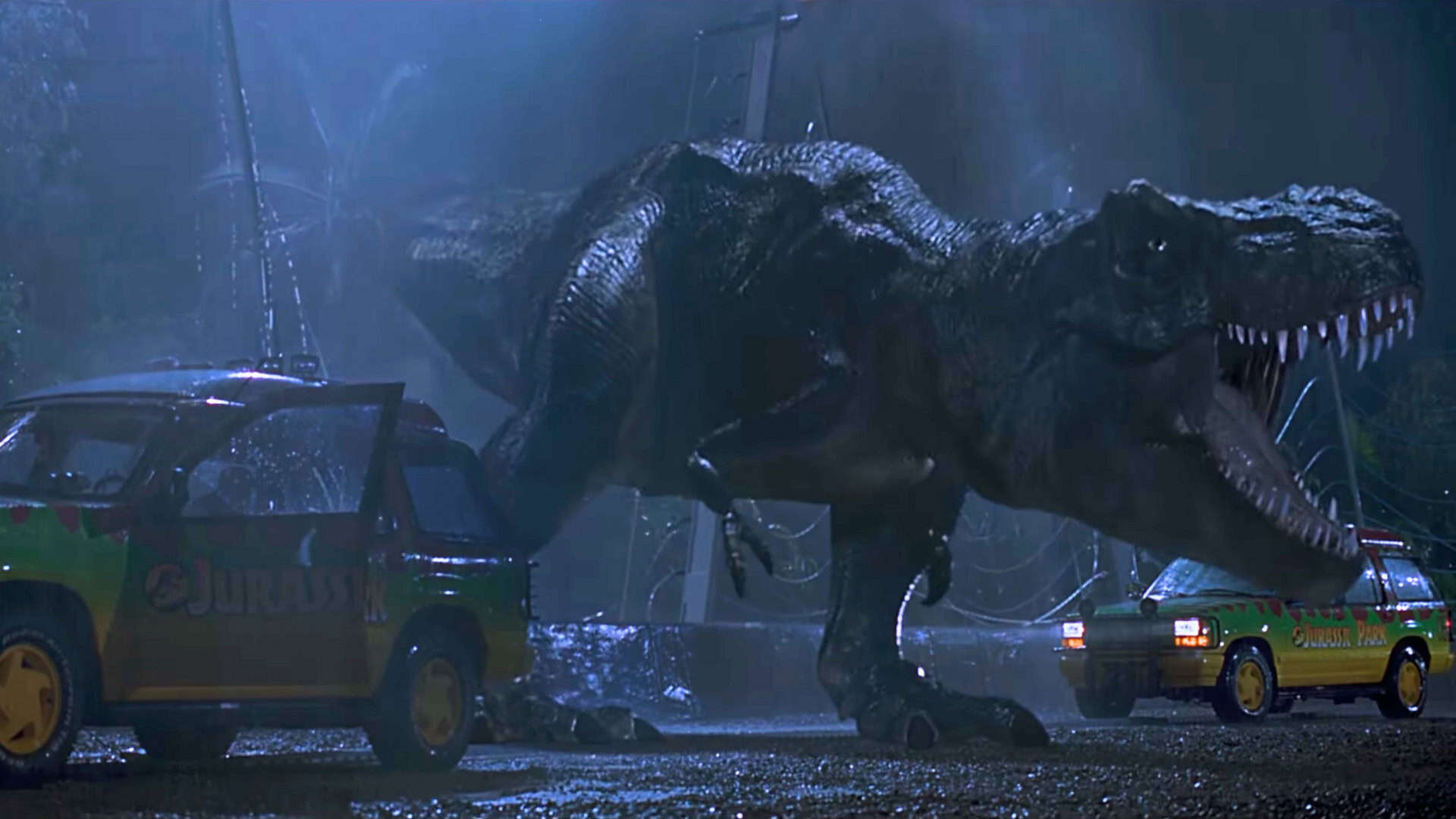 T-Rex rugindo em cena do filme Jurassic Park