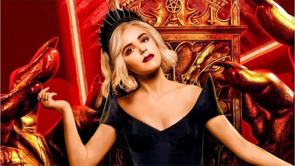Imagem de capa de O Mundo Sombrio de Sabrina/ Mulher loira de cabelos curtos e roupas pretas, sentanda em um trono dourado