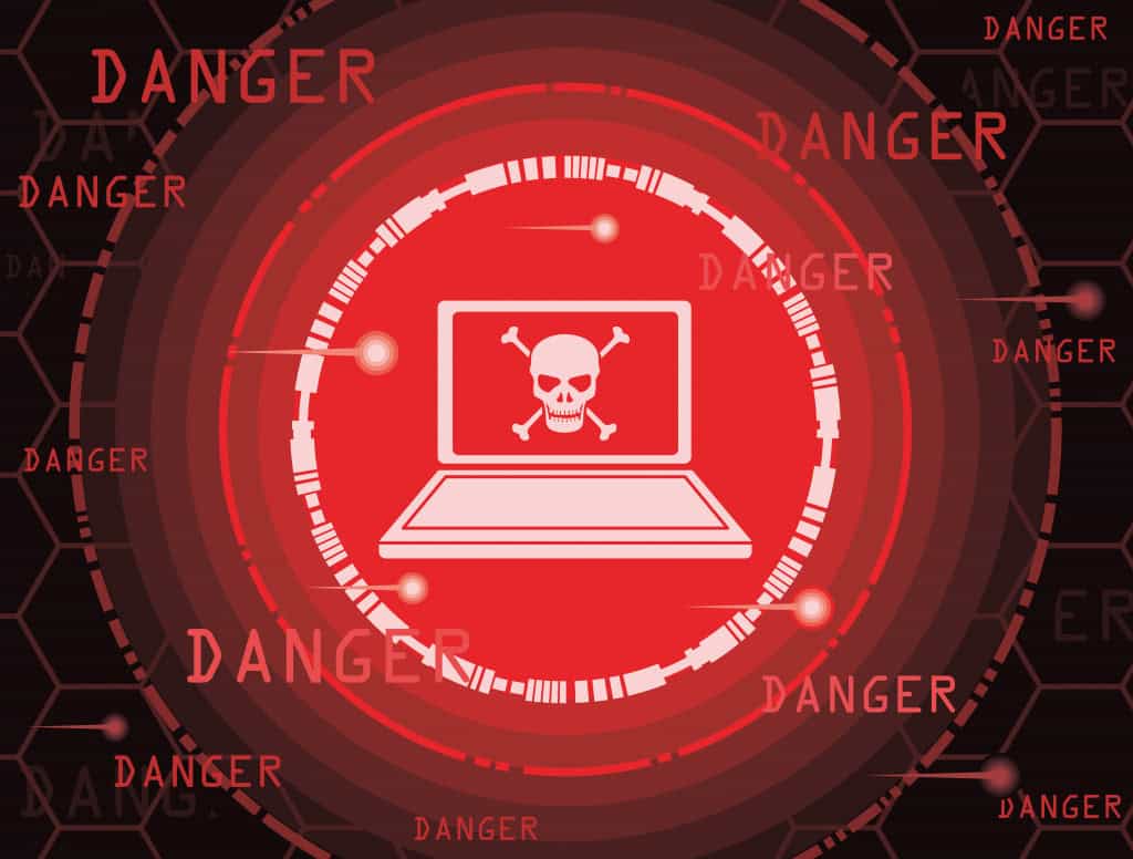 ilustração que mostra um computador com uma caveira no centro, para simular o perigo de vírus de computador