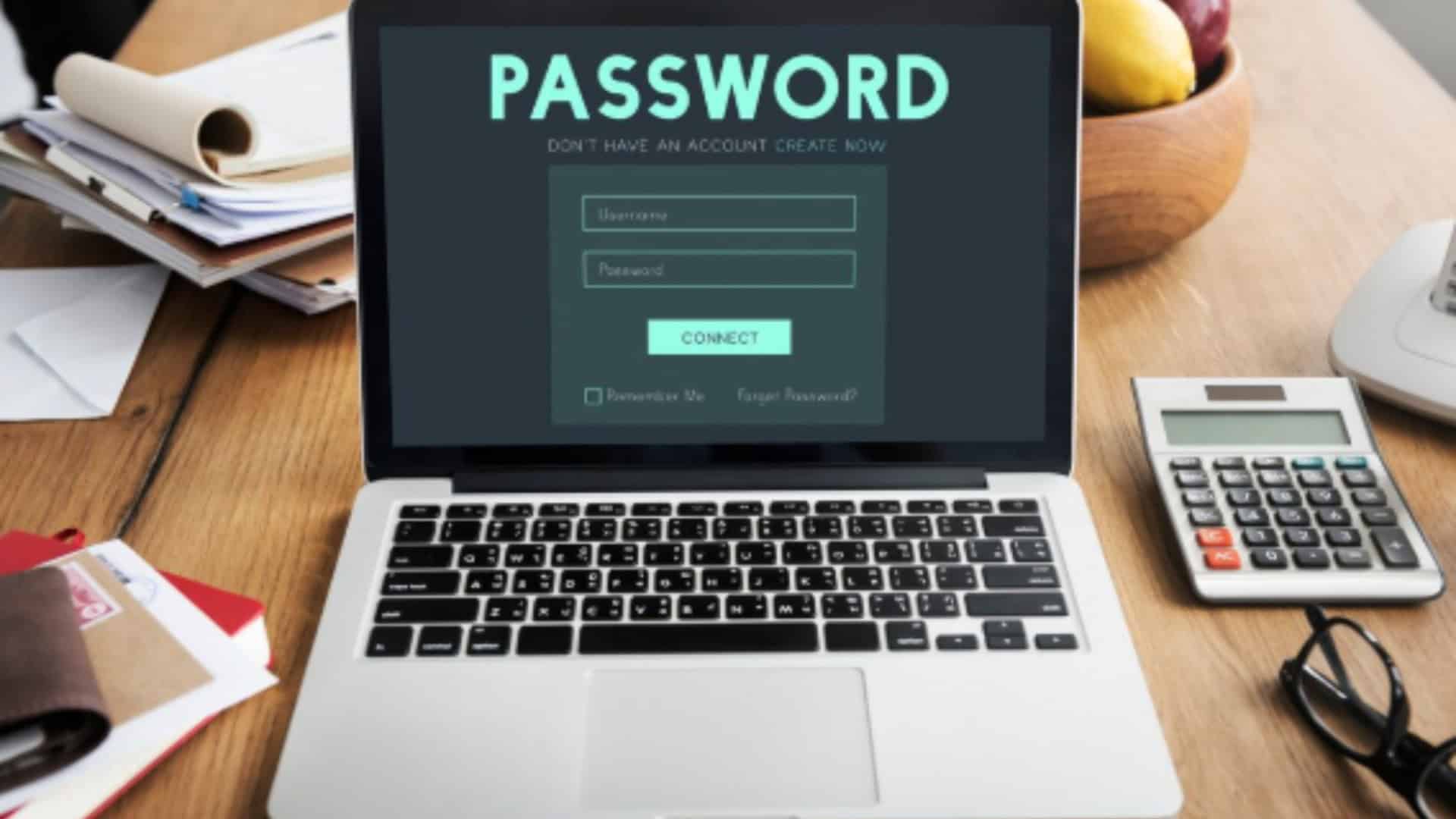 um laptop em cima de uma mesa com uma tela de acesso com senha