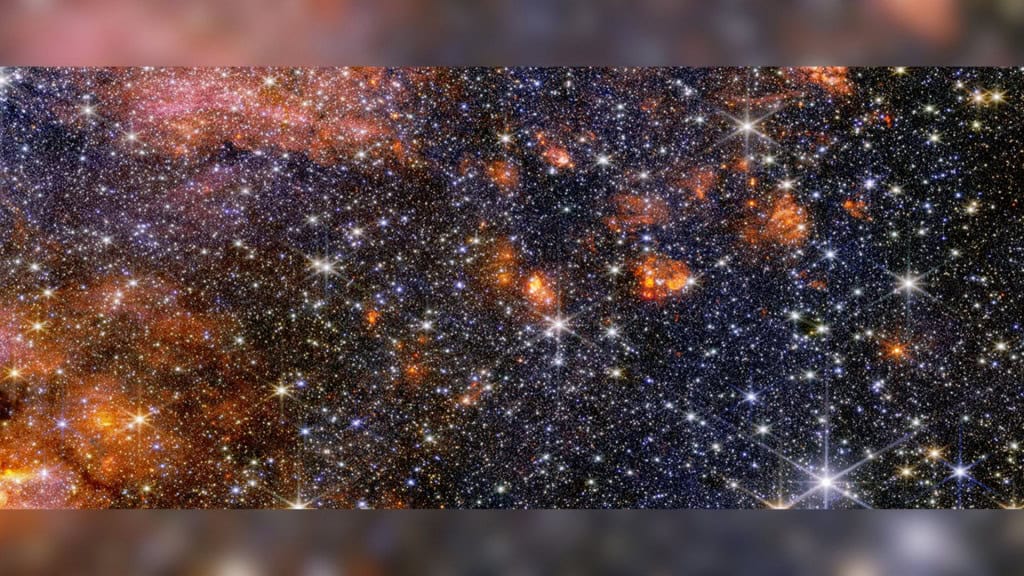 Estrelas, gás e poeira cósmica na nuvem de Sagitário B2 capturadas pelo telescópio James Webb
