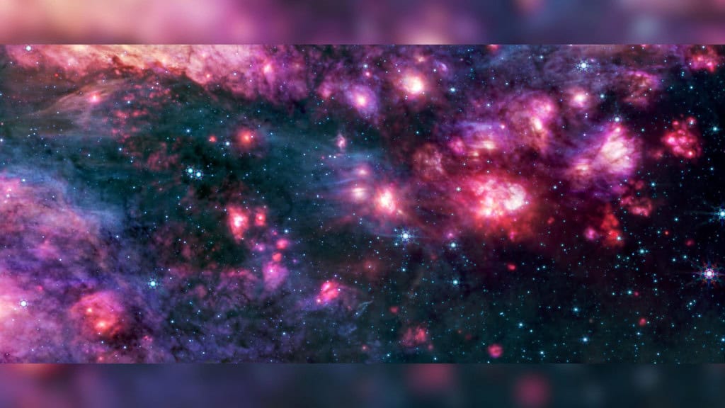 O MIRI do telescópio James Webb mostra a região B2 de Sagitário em luz infravermelha média, com poeira quente brilhando intensamente