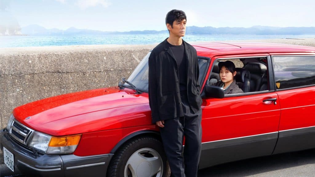 Man and a red car