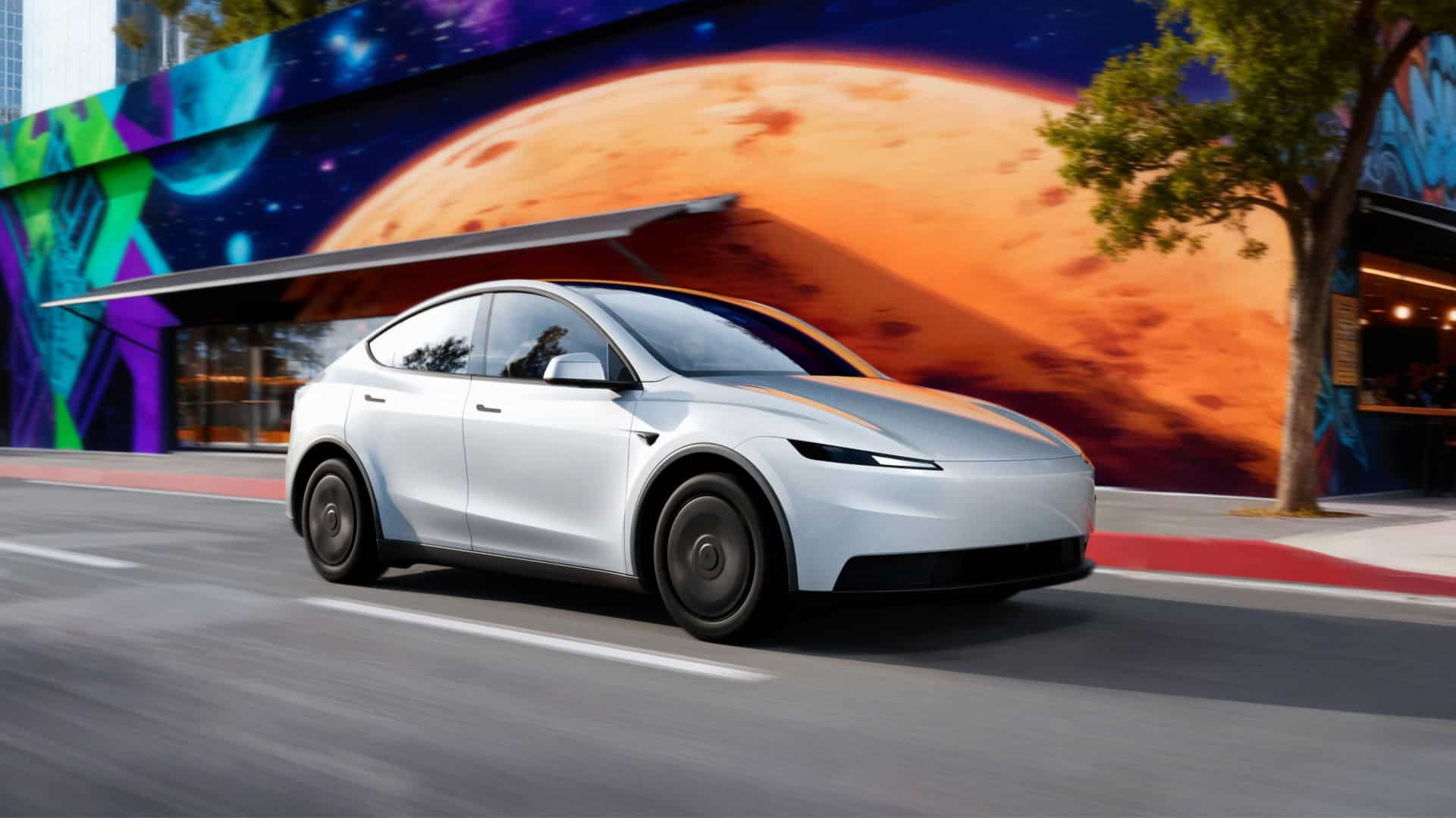 Novo modelo da Tesla andando em rua, passando por muro grafitado