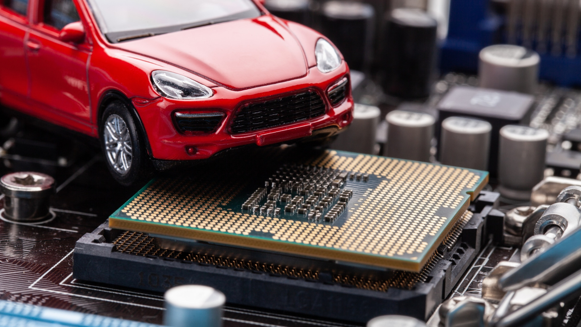 imagem mostra um carro em cima de um chip semicondutor