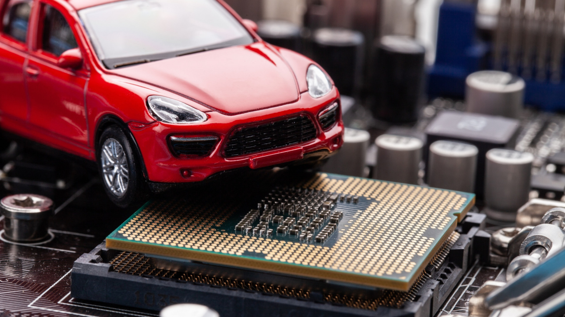 imagem mostra um carro em cima de um chip semicondutor
