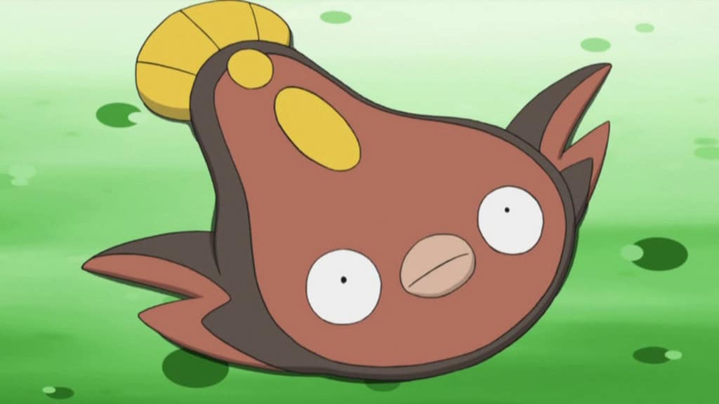 Pokémon Stunfisk sobre a grama