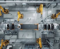 Vista de cima de linha de produção de carros em fábrica