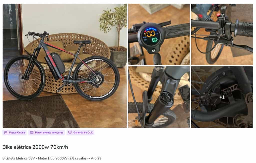 Captura de tela de um anúncio em marketplace ofertando uma "Bike elétrica 2000w 70km/h". A imagem exibe uma bicicleta preta com detalhes em vermelho, equipada com uma grande bateria no quadro e motor na roda traseira. Há fotos detalhadas do painel digital e, crucialmente, de um acelerador manual no guidão.