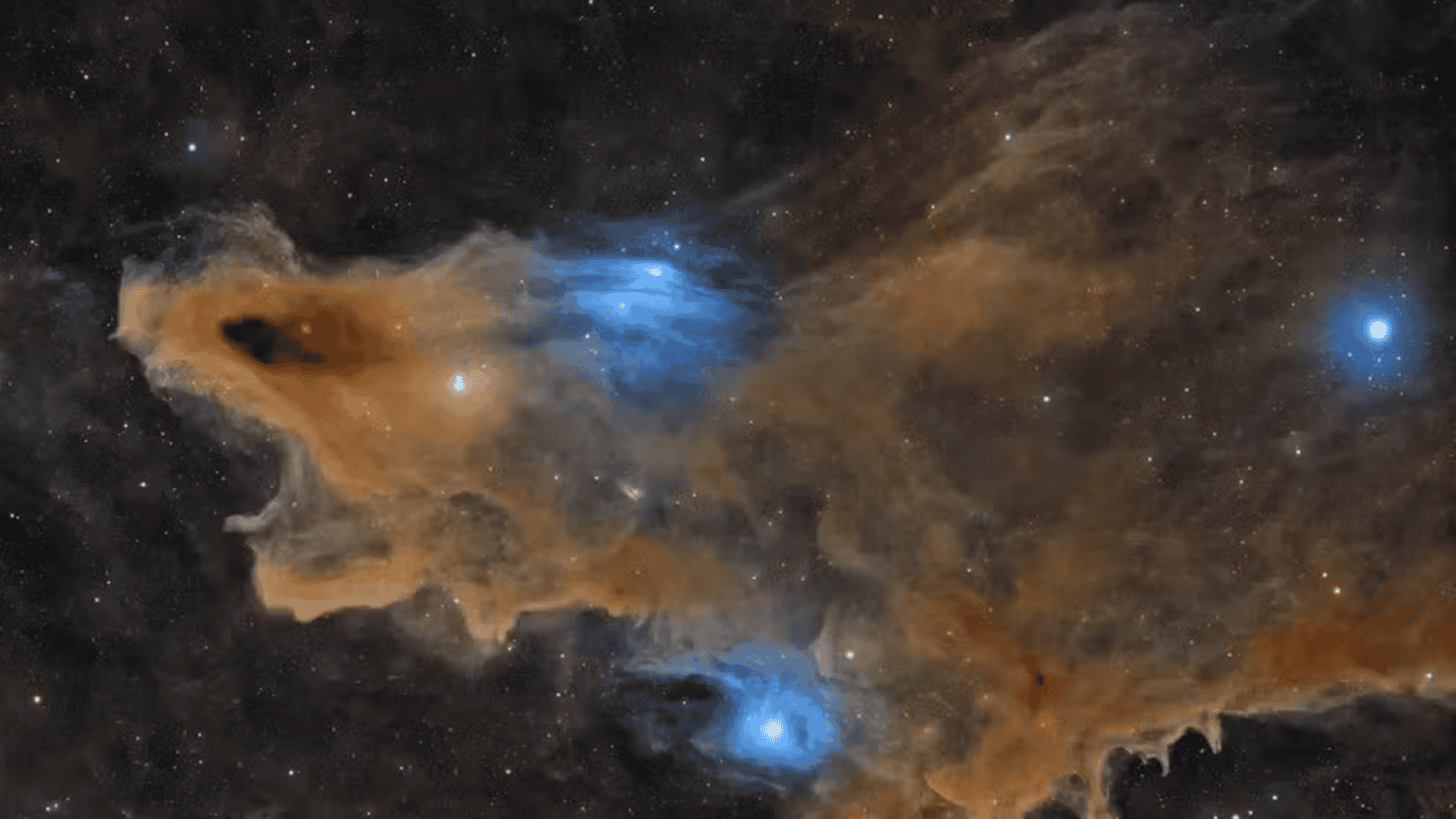 Formação de nuvens cósmicas escuras conhecida como Nebulosa do Tubarão