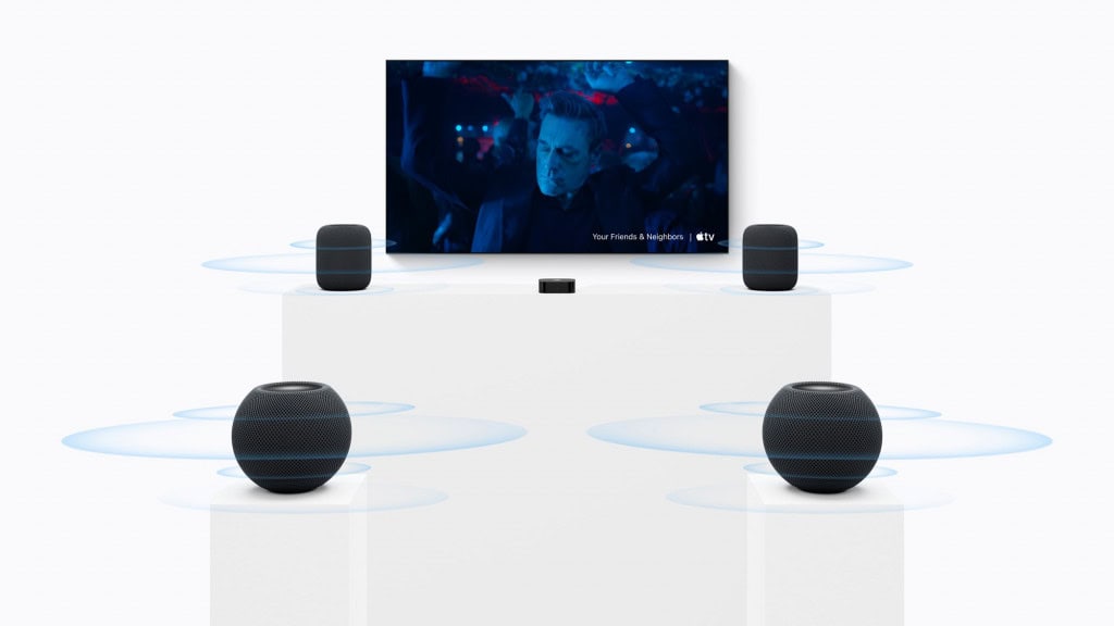 HomePod mini 2 e Apple TV 4K em uma configuração de som surround com quatro caixas de som.
